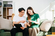 © Nuttapong punna - Happy asian young attractive couple man and woman with big boxes moving into a new house, new apartment for couple the new home, Moving house