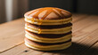 © Yuliatni - A delicious tall stack of golden pancakes with syrup.