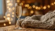 © 磊 崔 - dcf. A champagne flute with golden bubbles on a wooden table beside a cozy blanket and festive confetti. bar promotions, beverage menus, designed for food & beverage menus and cafe branding.