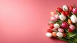 © Freshpixel - This lovely image showcases a vibrant bouquet of colorful tulips arranged beautifully against a soft pink background, celebrating nature's beauty and femininity.