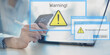 © WrightStudio - Security Warning Notifications Displayed on Digital Interface with Risk Alert Symbols.
