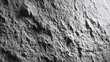 © Thiago - A detailed, textured view of rugged rock surface in monochrome