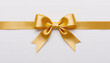 © AdilParvaiz.96 - Elegant Golden Satin Ribbon Bow on White Background