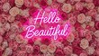 © Aleya - Neon sign saying hello beautiful against a dense wall of pink roses
