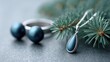 © Olha Atamaniuk - Luxury jewelry with blue pine branch for elegant holiday background.