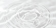 © md - Gentle concentric water ripples on pristine white surface, clean liquid.