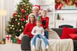 © New Africa - Happy family together in room decorated for Christmas