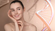 © New Africa - Beauty and science. Attractive woman against beige background with DNA