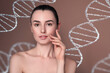 © New Africa - Beauty and science. Attractive woman against pale brown background with DNA