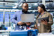 © DC Studio - Group of industry experts and engineers analyzing solar panel systems during a production inspection, ensuring engineering accuracy, quality control and factory operations efficiency.