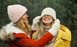 © rohappy - Happy smiling women friends having fun, celebration, joyful girlfriends together on Christmas tree