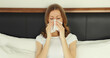 © rohappy - Sick exhausted young woman sneezing blow nose using tissue, unhealthy suffering girl feels unwell