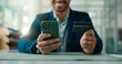 © peopleimages.com - Credit card, hands and phone with business man at desk in office for finance or stock market trading. App, mobile investment and portfolio management with broker in financial workplace for payment