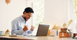 © OnPoint/peopleimages.com - Happy businessman, remote work or fist pump with laptop for good news, winning or promotion in home. Excited, male person or freelancer with smile, computer or bonus for business success in house