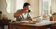 © peopleimages.com - Man, coffee and reading with laptop at house for research, copywriting and editor feedback. Person, remote work and beverage for proofreading on pc, update draft and story submission for publication