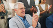 © SiphosethuFan/peopleimages.com - Media agency, applause and happy man in office, celebration and copywriting with achievement. People, journalist and mature person with smile, clapping and cheering with submission and publication