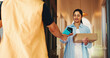 © peopleimages.com - Woman, delivery and phone with pos machine, box or payment for ecommerce or online order in home. Female person, customer or courier guy with mobile smartphone transaction for door package or parcel