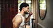 © peopleimages.com - Man, profile or brushing teeth with mirror in bathroom for dental hygiene or fresh breath. Male person, cleaning and grooming with toothbrush or morning routine in home for mouth, oral and gum care
