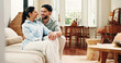 © peopleimages.com - Happy, sofa and couple in home talking for connection, bonding and relax in apartment. Laugh, marriage and man with woman in living room for conversation, healthy relationship and love on couch