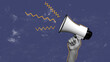 © fotofabrika - Communicators use megaphone to express ideas during a rally in an urban setting