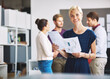 © peopleimages.com - Portrait, happy woman or team in office with paperwork for floor plan, interior design or creativity. Smile, person and designer with layout document for renovation blueprint, project report or info.
