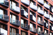 © yaqui_villegas - A structured geometric facade reflects modern residential architecture in HafenCity as housing surfaces combine clean lines and depth across Hamburg Germany shaped by contemporary design