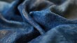 © na - A piece of deep blue fabric with varying shades from dark navy to lighter indigo, soft texture, slightly wrinkled,