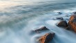 © Lucy - jetsam. Ocean waves smoothing rock surface over time in a coastal landscape. ESG reports, sustainability campaigns, designed for sustainability communications and ESG reporting.