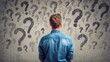 © Lady O - A man is standing with his back to the camera, looking at many question marks floating in front of him.