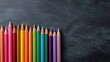 © filmanana - Colorful Pencils Aligned on Chalkboard for Creative Academic