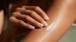 © Newleks - Hand applying moisturizing body lotion on tanned female skin, caring for healthy and soft dermis, beauty treatment for hydration and skincare routine