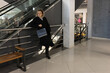 © Vasyl - Woman in black coat shopping in shopping mall