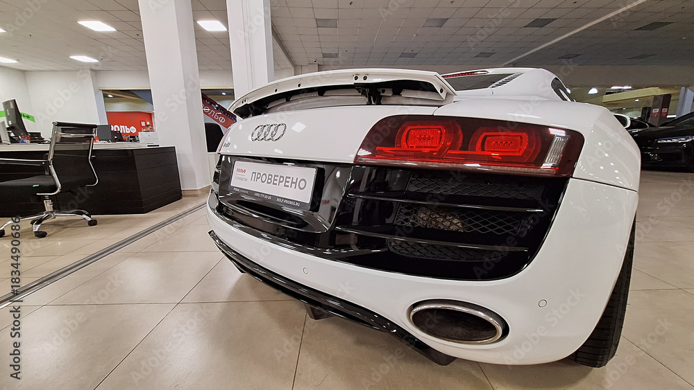 Russia, Moscow- 23 November 2025. White audi r8 rear view in showroom ...