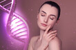 © New Africa - Beauty and science. Attractive woman against dusty rose background with DNA