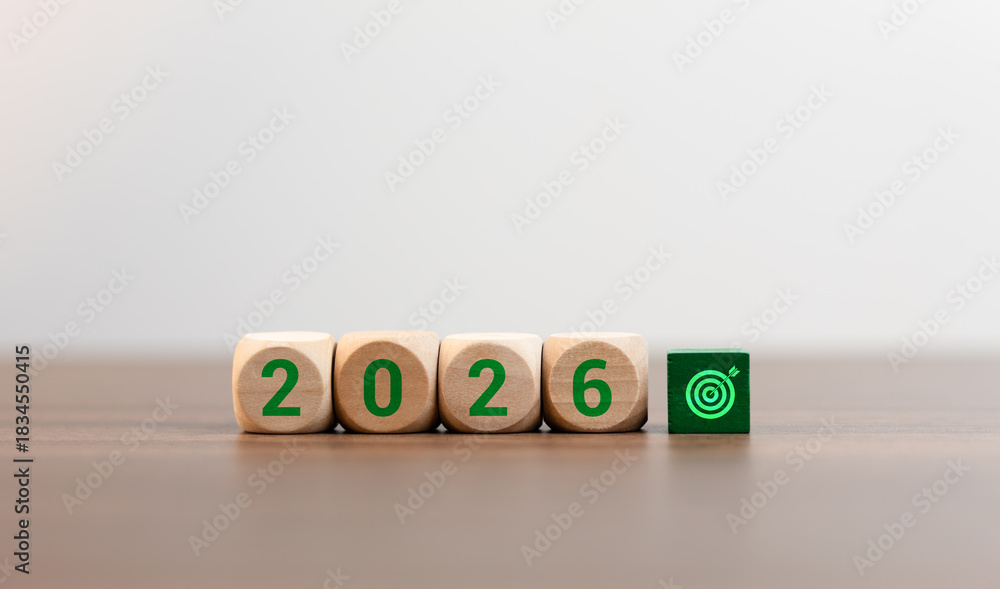 Wooden cubes with the text 2026 in green, featuring an arrow and a ...