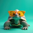 © Vadym - Cute turtle wears bright orange sunglasses. This reptile has a shell and scales. It looks cool and happy on a teal background. Summer vibes.