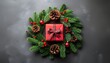 © Muammar - Overhead view of a festive Christmas wreath with a red gift box, pinecones, and berries on a dark background, conveying a merry Christmas mood with warm, earthy tones.