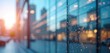 © Vadym - Blurred glass facade of a modern office building at sunset. Reflecting city lights and sky create an abstract backdrop for corporate themes and urban settings.