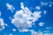 © Wittke Photography - Photograph of white cumulus clouds drifting across a bright and vibrant blue sky in the Blue Mountains in NSW, Australia.