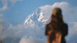 © Farknot Architect - Blurred rear view of a woman traveler with Machapuchare peak, Annapurna mountain range in Pokhara , Nepal