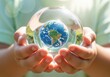© Meow Creations - Child hands holding a crystal sphere with the planet earth inside symbolizing global conservation and future.