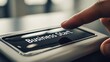 © AGUNG - Finger pressing 'Business Start' button on a device, close-up with shallow focus