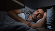 © D-point - Man suffering from insomnia and difficulty sleeping at night. Middle-aged man awake in bed, staring blankly. Sleep disorder concept.