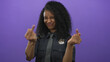 © Krakenimages.com - Young hispanic police officer woman shows both middle finger gestures while smiling in studio; defiance.