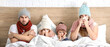 © Pixel-Shot - Family ill with flu in bed at home