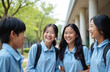© miss irine - Group of asian teen students laugh. They wear uniform and backpacks. Boy and girls talk, smile in school yard. Friendship, joy, study concept. Happy students having fun after classes outdoor.