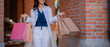 © Laingzaifa - Smiling young adults enjoying luxury shopping, laughing together, carrying bags, celebrating friendship, vibrant colours, successful lifestyle, joyful purchases, rich promotional.