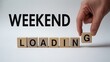 © Sajjad - Weekend loading concept with wooden blocks and hand changing letters