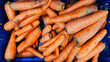© Mykola - Sale of washed carrots in plastic boxes. Sale of carrots, selective focus. Vegetables in a supermarket close-up.