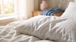 © Alex_Kalin - A rumpled white pillow on a bed in bright morning light. Cozy and comfortable bedroom interior for rest and relaxation